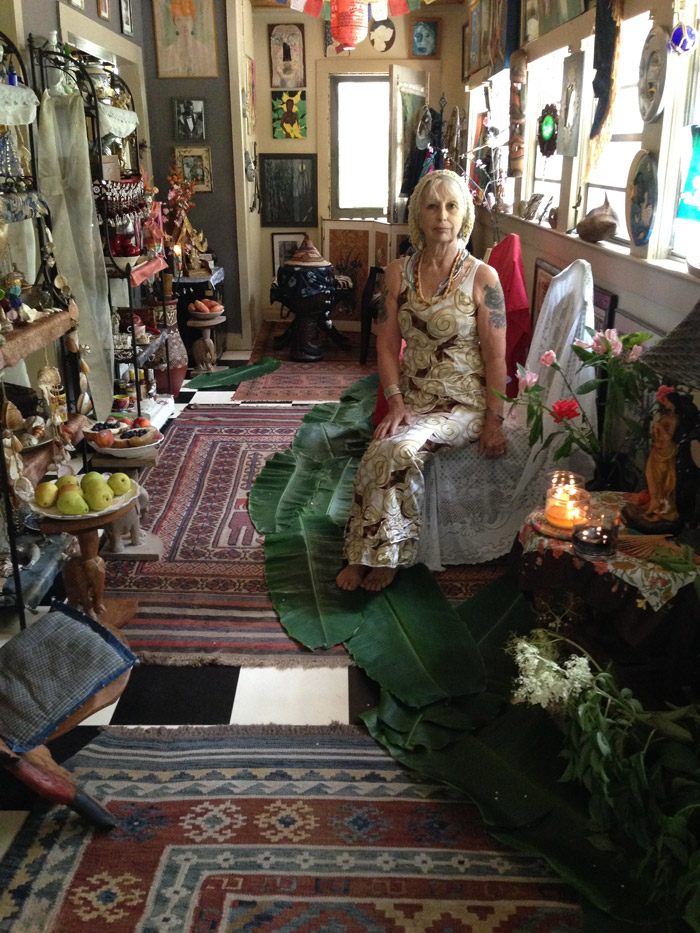 Voodoo Priestess Severina Singh sitting in her voodoo temple room