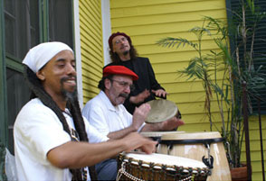 Iyah-Ra playing the drums with the rest of the Voodoo Crossroads Drummers