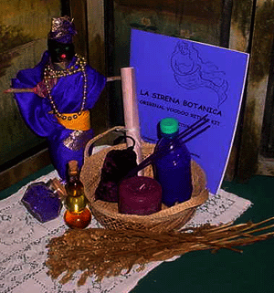 Voodoo spell kit with a voodoo doll, gris-gris, aromagick oil, aromagic bath salts, floor wash, incense, hand-painted candle and parchment paper, plus detailed instructions